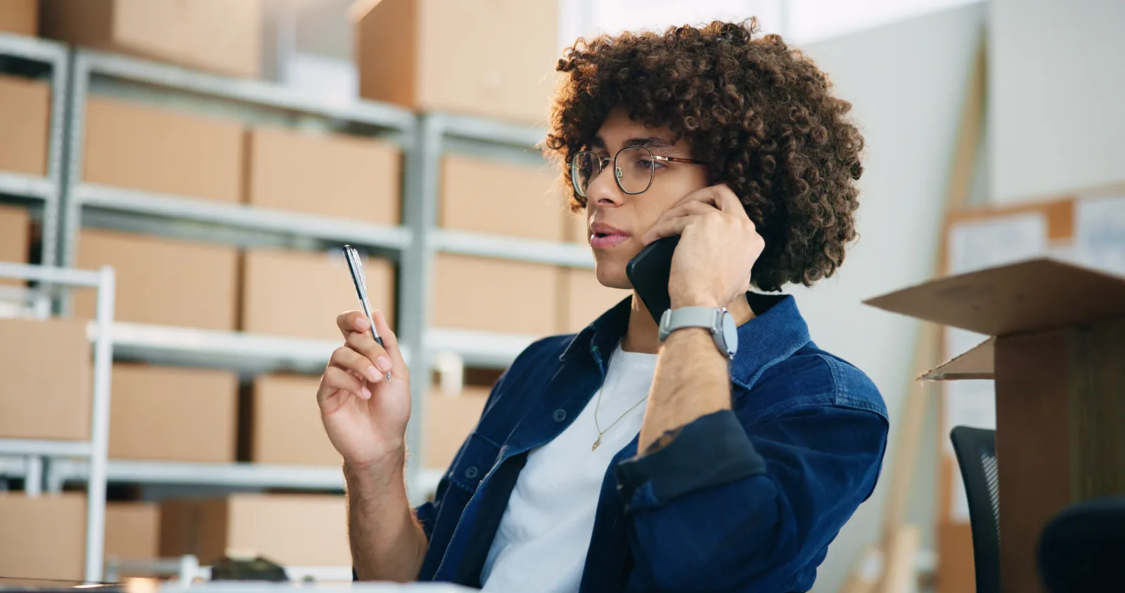 TempAid Innovation Center specialist on a call in the warehouse